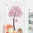Pink floral wall decal on a white wall 