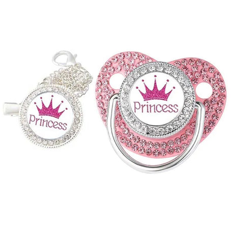 Pink 'Princess' pacifier with decorative elements on a white background