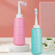 Pink and blue cleaning devices on a white surface with a pink background