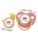 Pink and gold pacifier with 'Princess' text and crown design, measurements indicated.