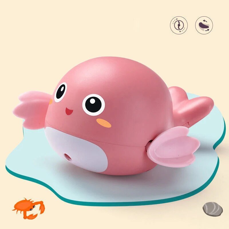 Pink cartoon-like toy with a smiling face on a beige background