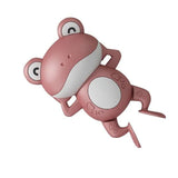 Pink frog-shaped toy on a white background