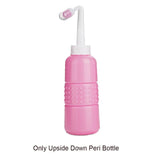 Pink peristaltic pump bottle with white nozzle on a white background