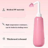 Pink water spray bottle with text on medical material, high temperature resistance, and thickened rebound on a pink background.