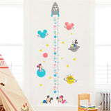 Children's growth chart with space-themed design.