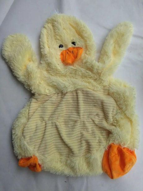 Plush toy duck with orange feet and beak on a white background