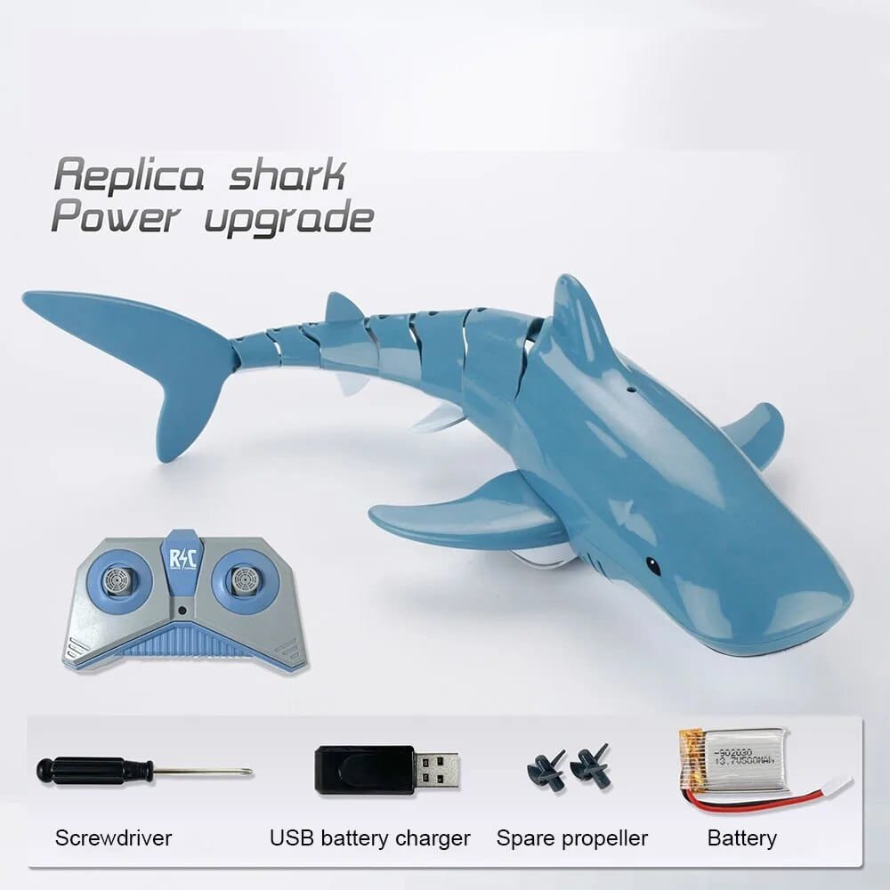 Replica shark power upgrade kit with remote control, screwdriver, USB charger, spare propeller, and battery.