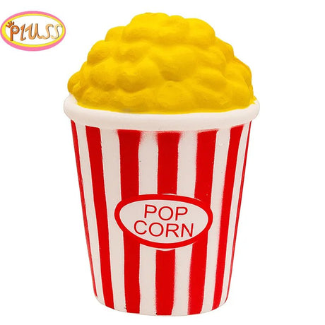 Popcorn container with yellow popcorn on a white background