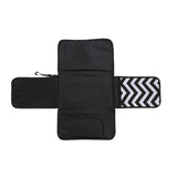 Black diaper changing pad with zigzag pattern