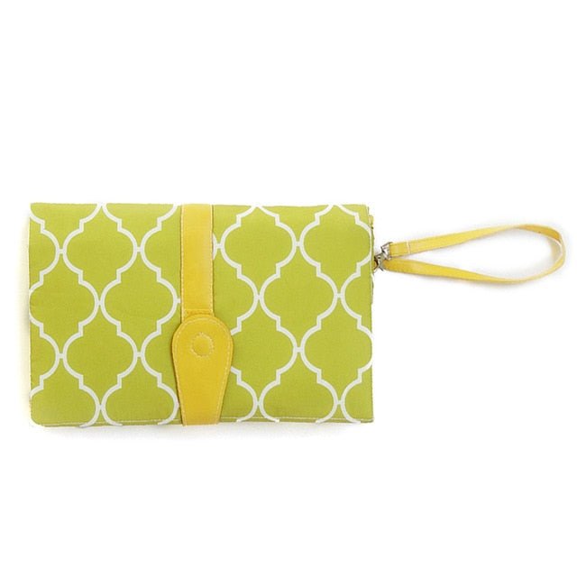 Green patterned clutch with yellow strap
