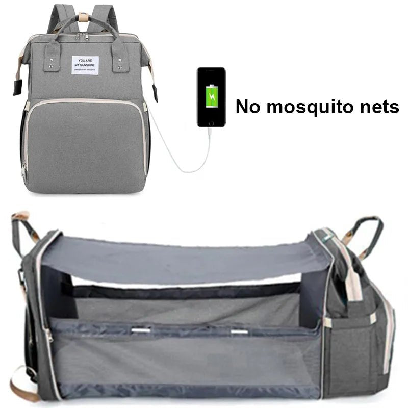 Gray backpack with a baby crib extension and a smartphone with a green battery icon.