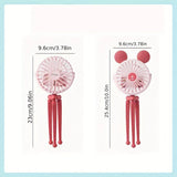 Two pink handheld fans with red sticks and measurements.