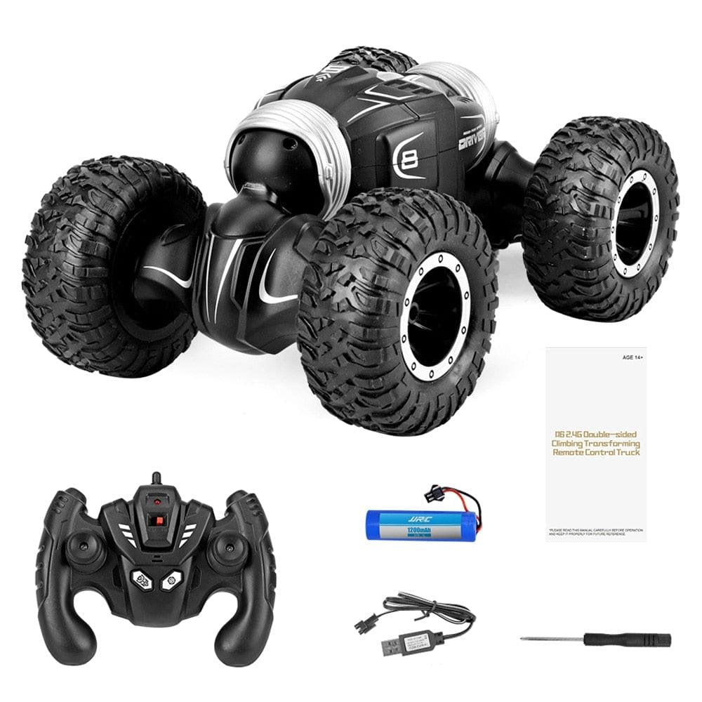 Remote control toy truck with controller, battery, and USB cable.