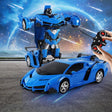 Blue toy car transforming into a robot with a remote control held by a hand.