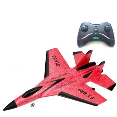 Red toy airplane with black accents and a remote control 