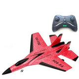 Red toy airplane with black accents and a remote control 
