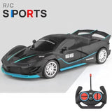 Black and blue toy sports car with remote control on a gray background, featuring 'R/C Sports' text.