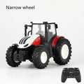 Toy tractor with narrow wheels and a remote control.