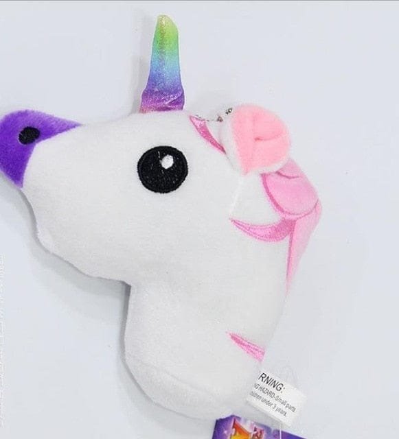 Plush toy unicorn with a colorful horn.