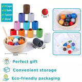 Colorful wooden toy set with cups, balls, a spoon, and a bowl.