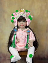  Doll with traditional outfit and headpiece on a wooden background