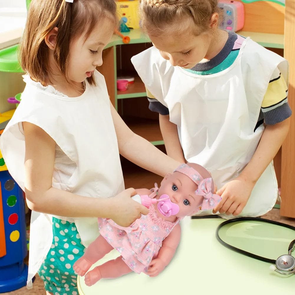 Two young girls playing with a baby doll in a colorful playroom.