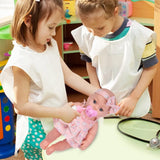 Two young girls playing with a baby doll in a colorful playroom.
