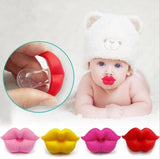 Baby wearing a white hat with red 'lips' pacifier.