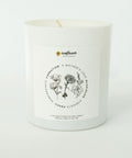 Candle with floral design and text