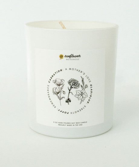 Candle with floral design and text