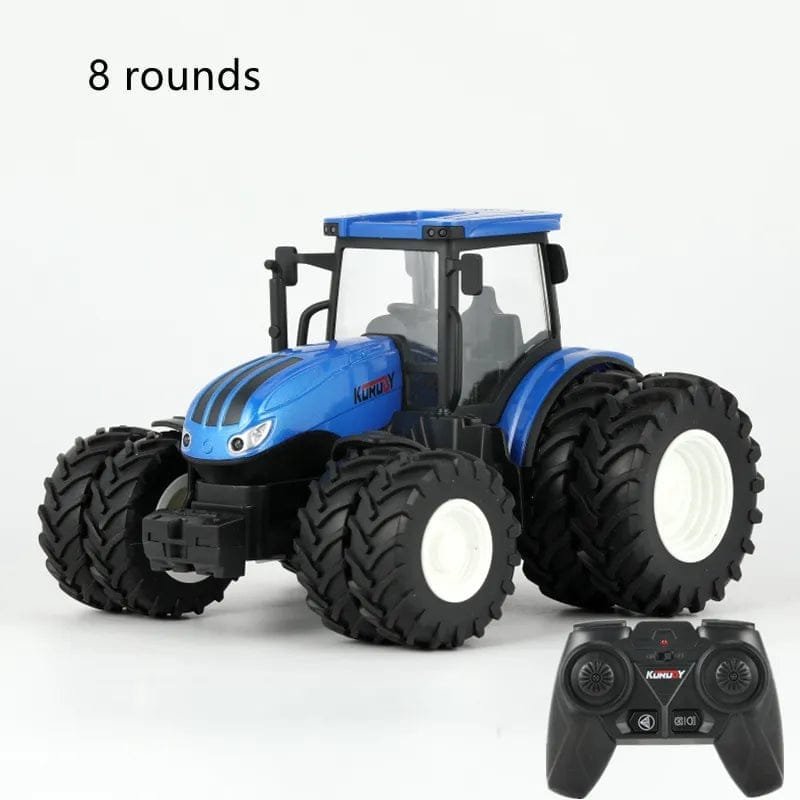 Blue toy tractor with large wheels and a remote control.