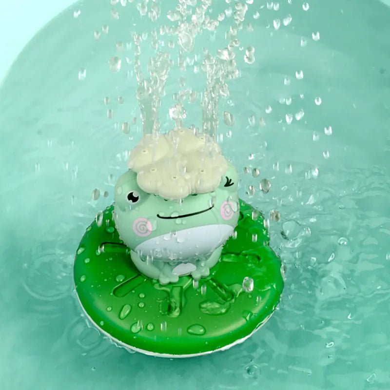 Green frog-shaped bath toy with water splashing around it.