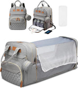Gray diaper bag with quilted design, backpack straps, and baby bassinet extension on a white background.