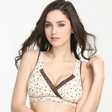 Woman wearing a patterned bralette with lace trim on a white background