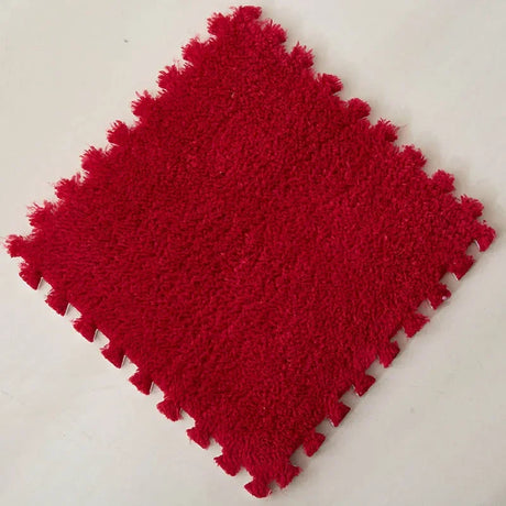 Red textured square mat on a white background
