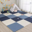 Children's playroom with a blue and white foam puzzle mat, toy chest, and teepee.