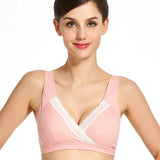 Woman wearing a pink bralette with lace trim on a white background