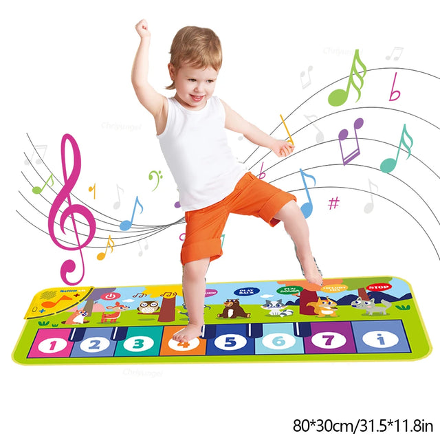 Child playing on a colorful musical mat with music notes around