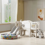 Children's playset with slide and ball pit in a room with large window