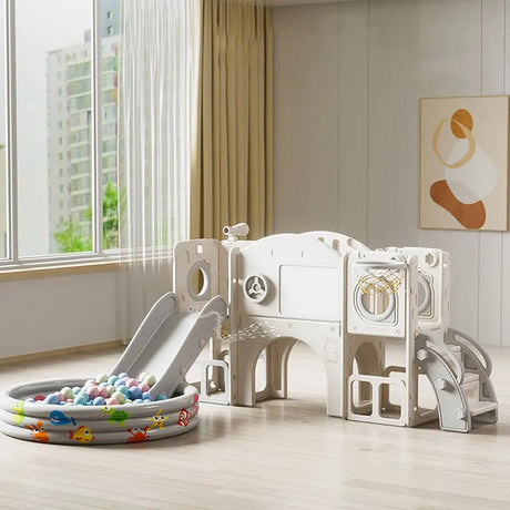 Children's playset with slide and ball pit in a room with large window