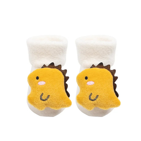 Baby socks with yellow dinosaur design on a white background