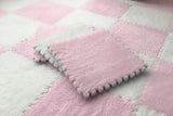 Pink and white checkered blanket with textured surface
