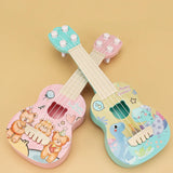 Two colorful toy guitars with cartoon designs on a beige background