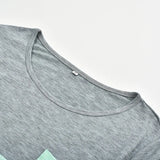 Gray t-shirt with a close-up of the neckline on a light gray background