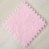Pink textured square tile on a light gray background