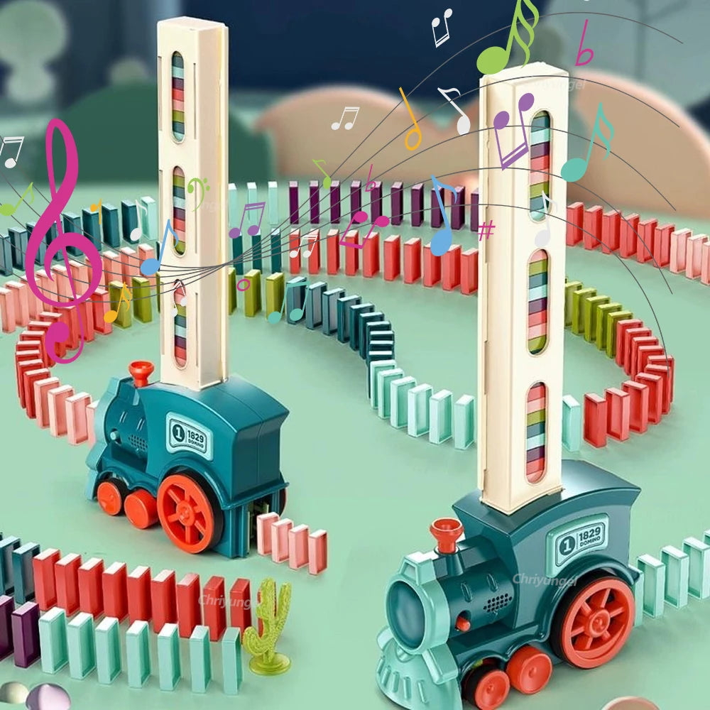 Colorful domino train set with moving towers and musical notes on a green background