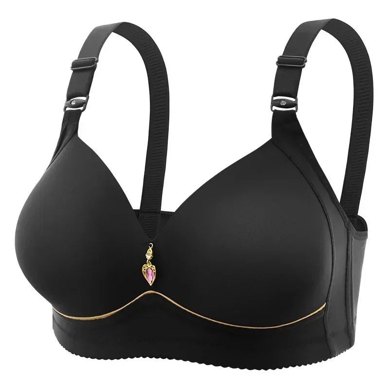Black bra with decorative charm on a white background