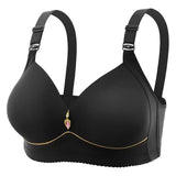 Black bra with decorative charm on a white background