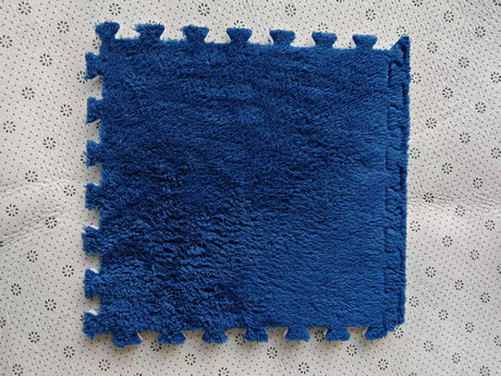 Blue textured square mat on a light gray background