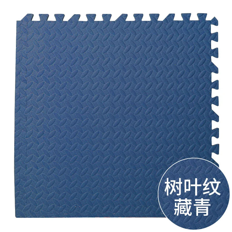 Blue textured foam puzzle mat with a diamond pattern on a white background
